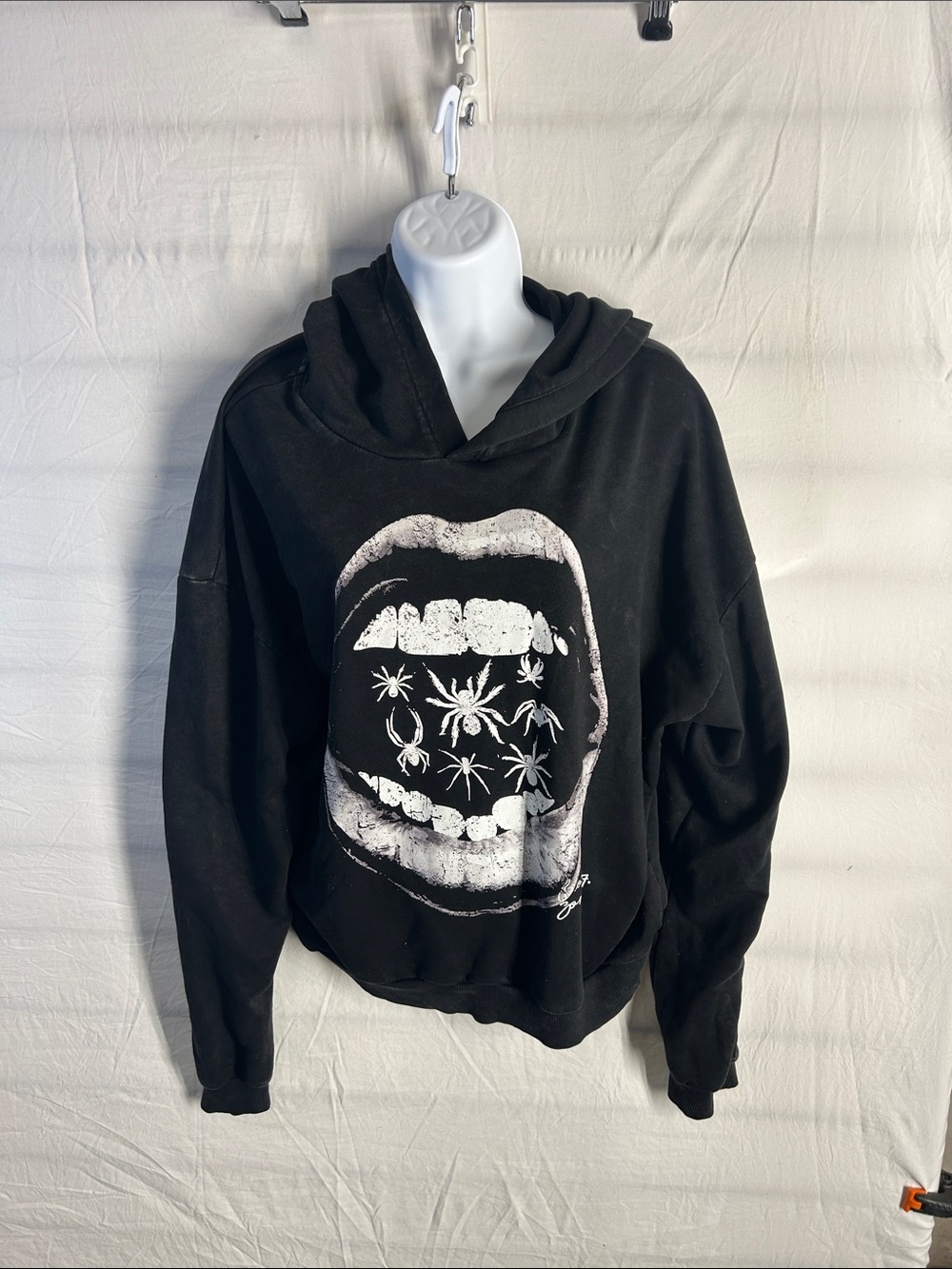 Graphic Black Hooded Sweatshirt with White Mouth Design